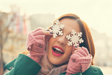 Female Holding Snowflake Decoration