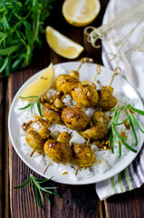 Skewers of mushrooms with a side dish of rice