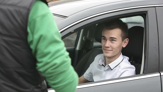 Young guy takes his car to the service station
