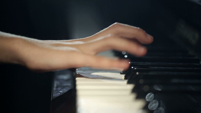 The child learns to play the piano. Video with sound.