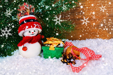 Christmas background with snowman and gifts