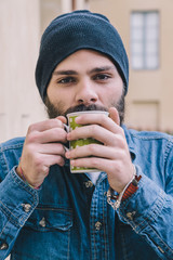 Portrait man - Hipster drinking from a cup