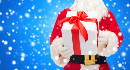 man in costume of santa claus with gift box