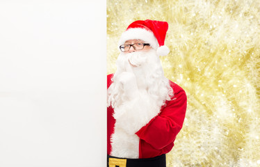 man in costume of santa claus with billboard