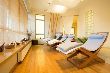 Loungers in spa room - obrazy, fototapety, plakaty