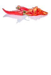 Cut slices of red chili pepper on white background