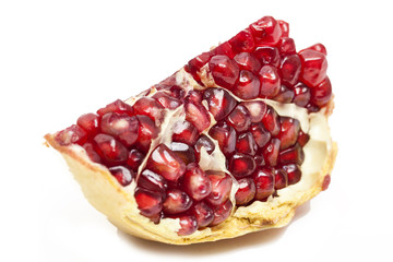 Juicy pomegranate isolated on white background