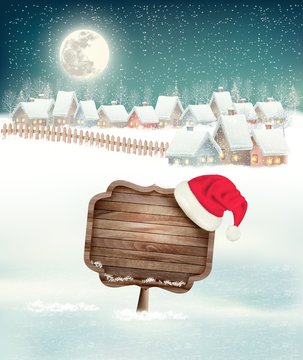 Winter holiday christmas background with a village, a sign and a