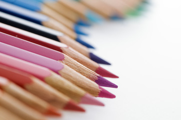Colored pencils in a row wavy