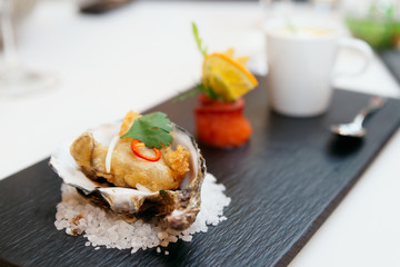 Tempura fried oyster in shell