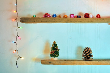 christmas decorations on shelf with christmas light