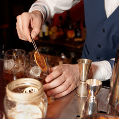Barman works at bar counter