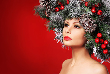 Christmas Woman. Fashion Girl with Decorated Hairstyle. New Year