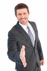 Businessman smiling and offering his hand