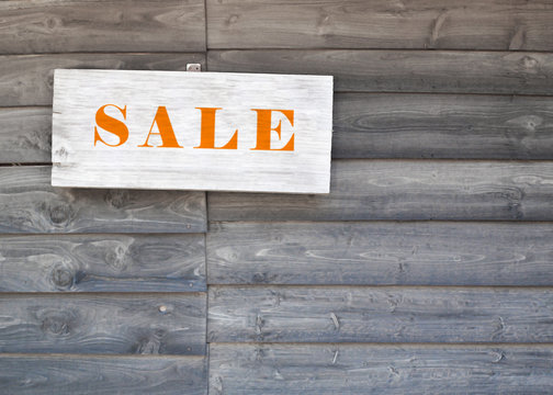 sale text sign with wood texture background