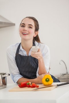 Pretty Brunette Cooking And Watching Tv