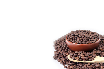 wooden spoon on a background full bowl of coffee beans