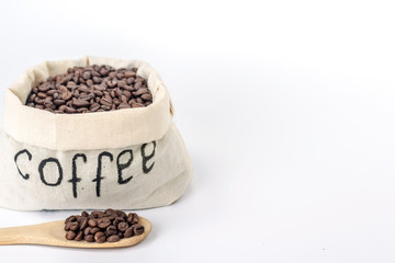 wooden spoon on a background of a full bag of coffee beans