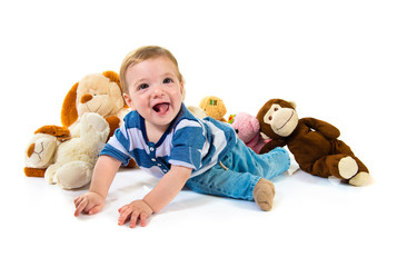 Cute baby playing with stuffed animals