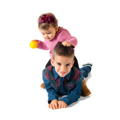 Brothers playing over white background