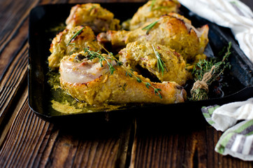 Pieces of chicken baked with cheese and garlic