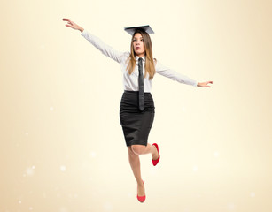 Fototapeta na wymiar young businesswoman in equilibrium over white background