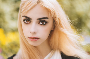 Portrait of a beautiful blonde girl. Color toned image.