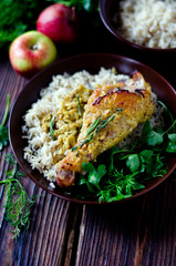Baked chicken leg with rice garnish