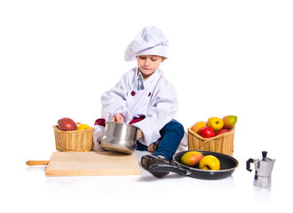 Blonde little girl dressed like chef