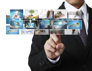 Man pushing on a touch screen digital photos