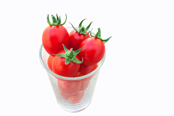 Fresh tomato fruit in glass