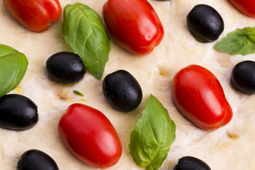 Focaccia with black olives, tomatoes and basil