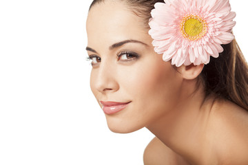 Portrait of young beautiful young woman with gerbera