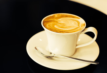 Latte coffee cup on table