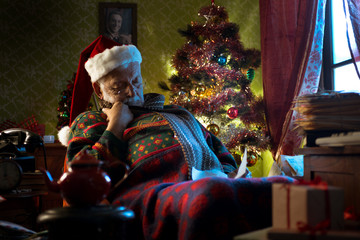 Santa Claus napping on his armchair