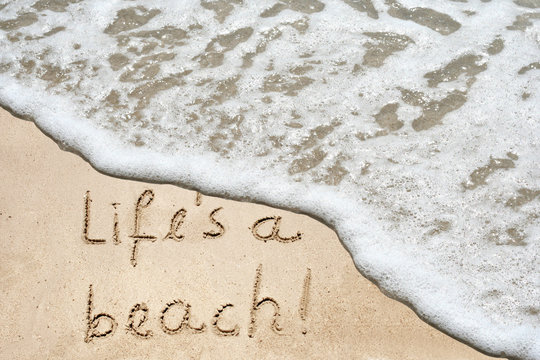 Conceptual life is a beach text in sand and water