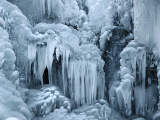 A frozen waterfall with ice in winter - Powered by Adobe