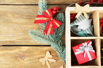 Beautiful Christmas composition with gifts in wooden crate