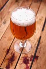 Glass of beer in a crate