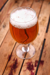 Glass of beer in a crate