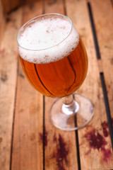 Glass of beer in a crate