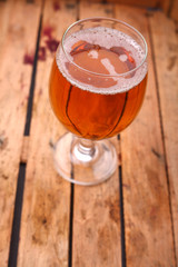Glass of beer in a crate