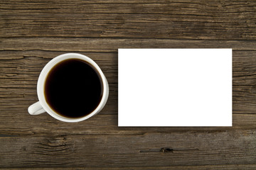 Obraz na płótnie Canvas cup of coffee and paper sheet
