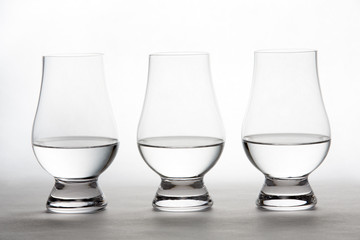 Vodka in Three Crystal Tasting Glasses