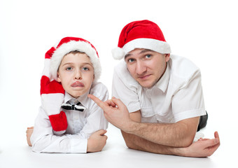 father and son in Santa's hats