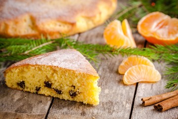 Christmas piece of biscuit cake with mandarin  and cinnamon