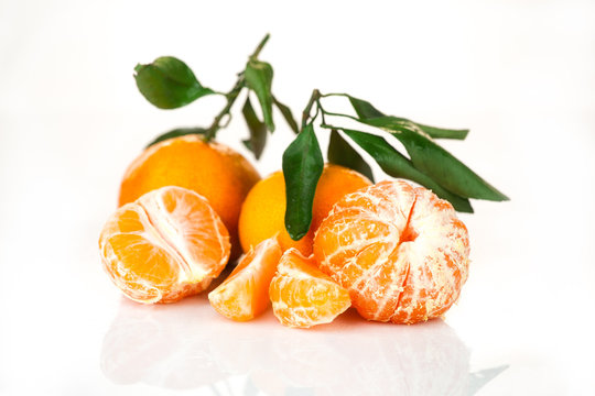 fresh mandarin with leaf isolated on white