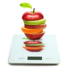 Fruits on digital weight scale