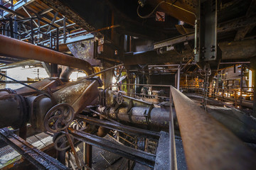 Industrial, rusty construction and machines in old Factory