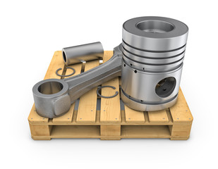 Piston on wooden pallet on white backgound